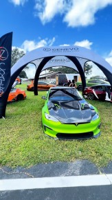 Green show car under the GENEVO arch at Slamfest 35 in Tampa